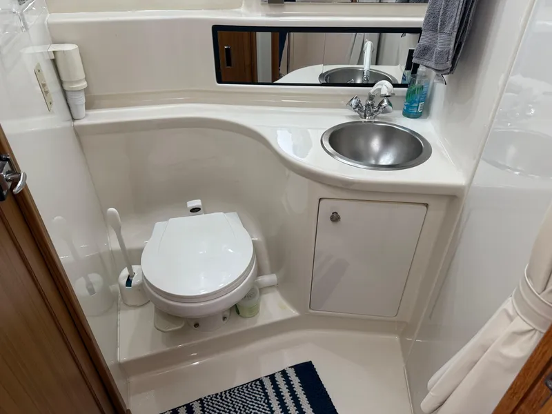 Slide: The Image of Bathroom in 2001 Bayliner 3988 Command Bridge Motoryacht with toilet, sink, and mirror. - 40