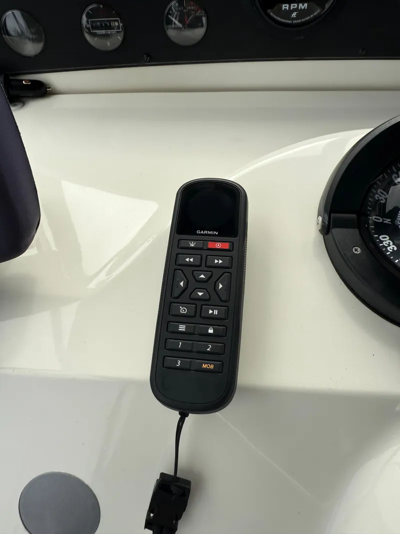 Slide: The Image of Garmin remote control on Bayliner 3988 Command Bridge Motoryacht dashboard, 2001 model. - 49