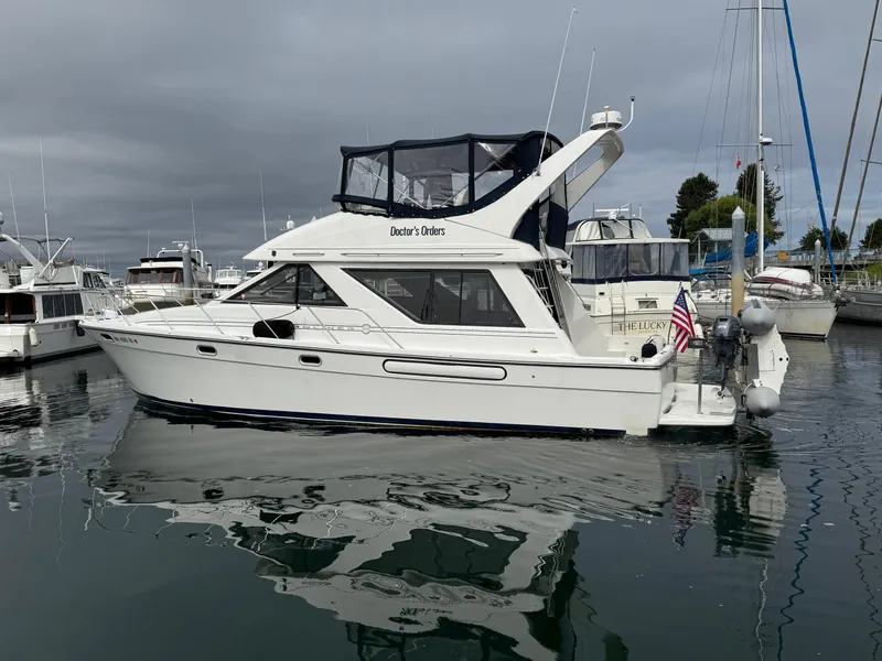 Slide: The Image of 2001 Bayliner 3988 Command Bridge Motoryacht docked in a marina. - 6