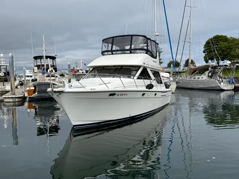 Slide: The Image of 2001 Bayliner 3988 Command Bridge Motoryacht docked in a marina. - 8