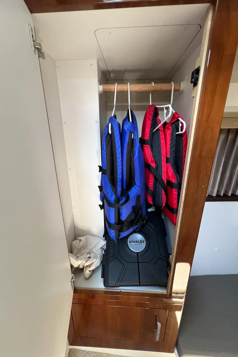 Slide: The Image of Life jackets in a 2016 Carver C34 Command Bridge closet. - 19