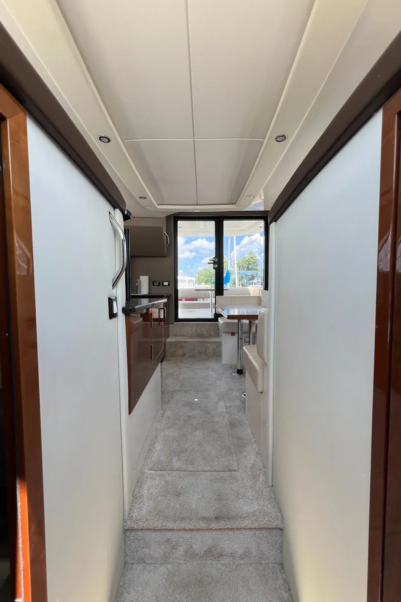 Slide: The Image of Interior view of 2016 Carver C34 Command Bridge yacht, featuring modern design and spacious layout. - 25
