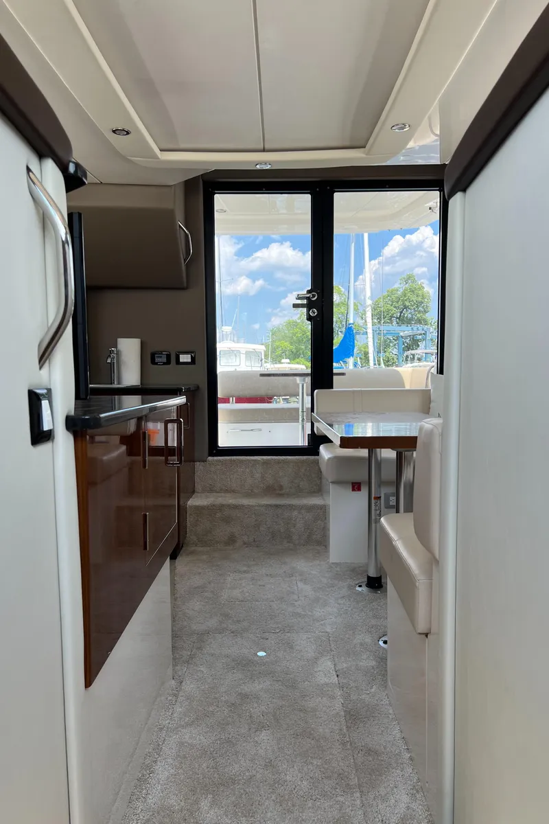 Slide: The Image of Interior view of 2016 Carver C34 Command Bridge yacht, featuring modern design and comfortable seating. - 26