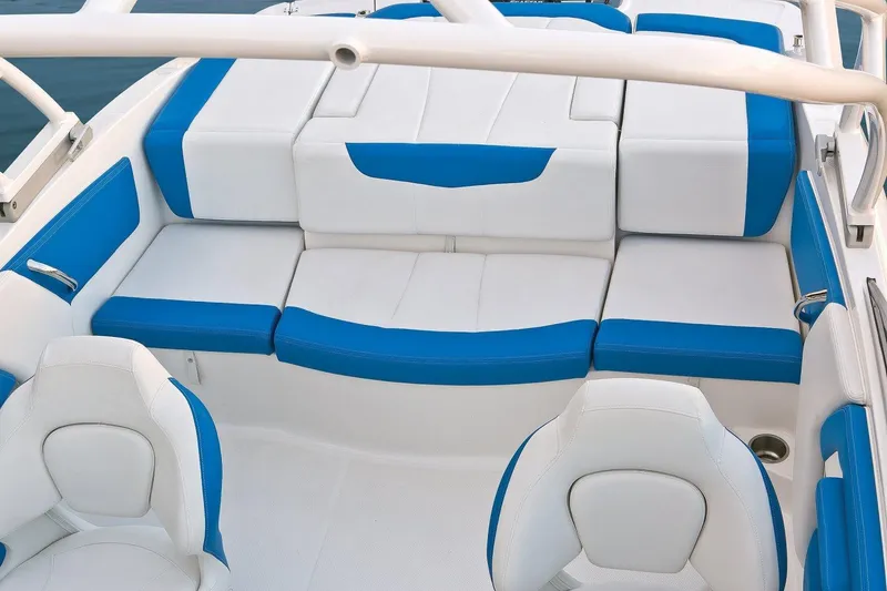 Slide: The Image of 2018 Chaparral 21 H2O Sport OB boat interior with white and blue seating. - 61