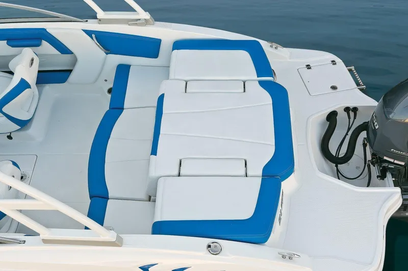 Slide: The Image of 2018 Chaparral 21 H2O Sport OB boat interior with blue and white seating. - 63