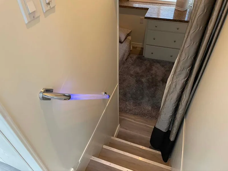 Slide: The Image of Staircase with illuminated door handle leading to cozy room, Thoroughbred 6516, 2004. - 11