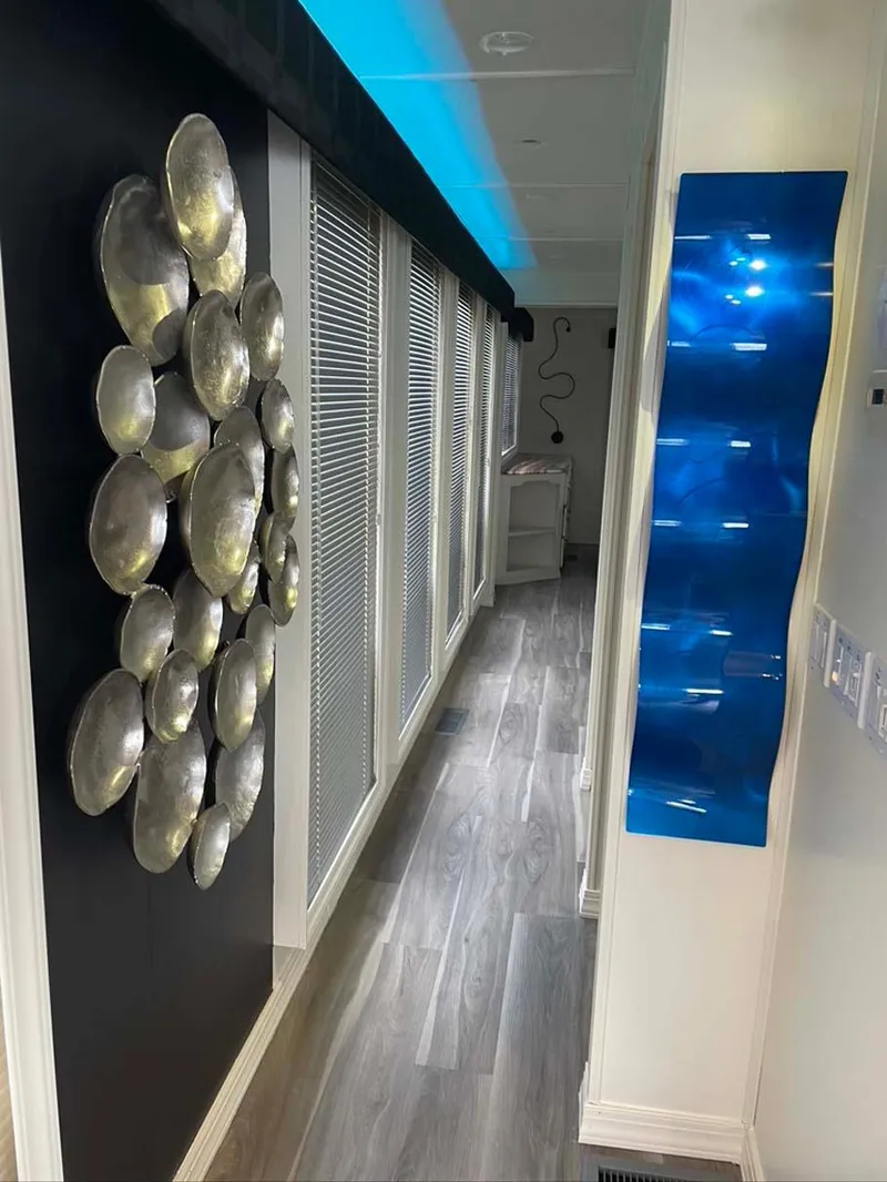 Slide: The Image of Modern hallway with abstract wall art in a 2004 Thoroughbred 6516 model. - 17