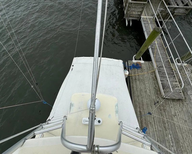 Slide: The Image of Top view of 2005 Custom Stardust 32 Express boat docked at a wooden pier. - 15