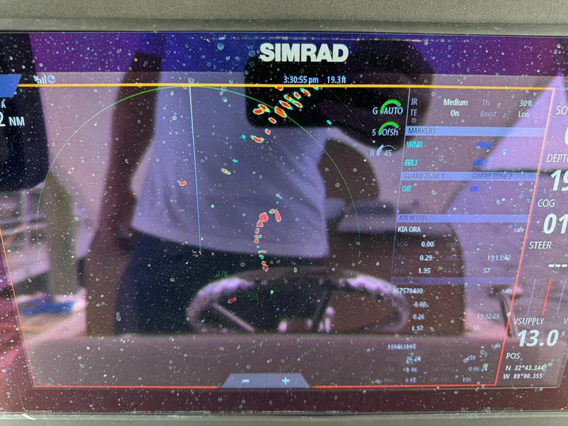 Slide: The Image of Simrad marine navigation display on Custom Stardust 32 Express, 2005 model. - 23