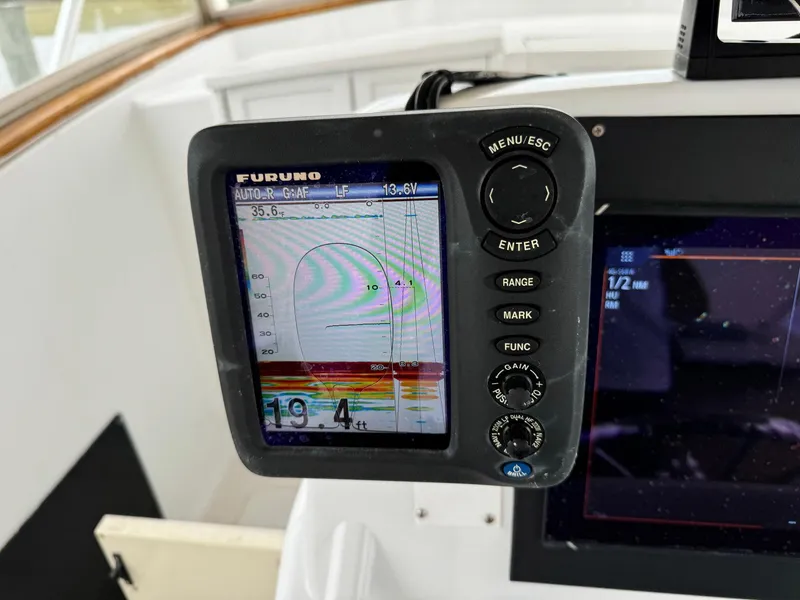 Slide: The Image of Fishfinder display on a 2005 Custom Stardust 32 Express boat, showing sonar readings. - 25