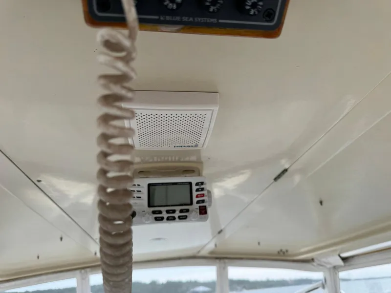 Slide: The Image of Interior view of a 2005 Custom Stardust 32 Express boat with communication equipment. - 27