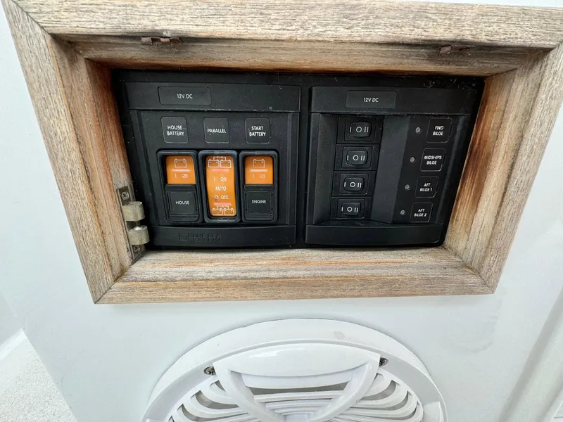 Slide: The Image of Electrical panel on 2005 Custom Stardust 32 Express boat with switches and speaker. - 29