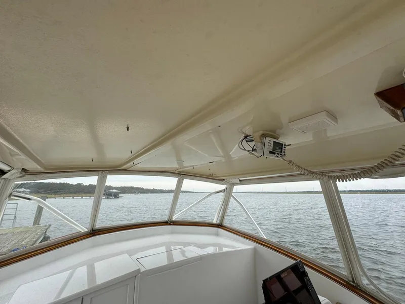 Slide: The Image of Interior view of 2005 Custom Stardust 32 Express boat with water in the background. - 30
