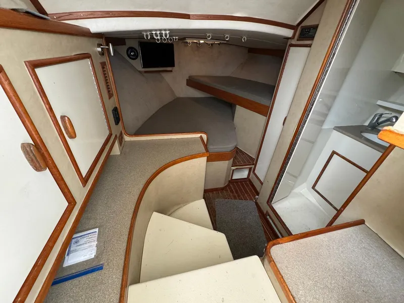 Slide: The Image of Interior of 2005 Custom Stardust 32 Express boat with cozy cabin and modern amenities. - 34