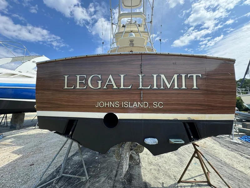 Slide: The Image of Custom Stardust 32 Express boat, "Legal Limit," docked at Johns Island, SC, under a blue sky. - 40