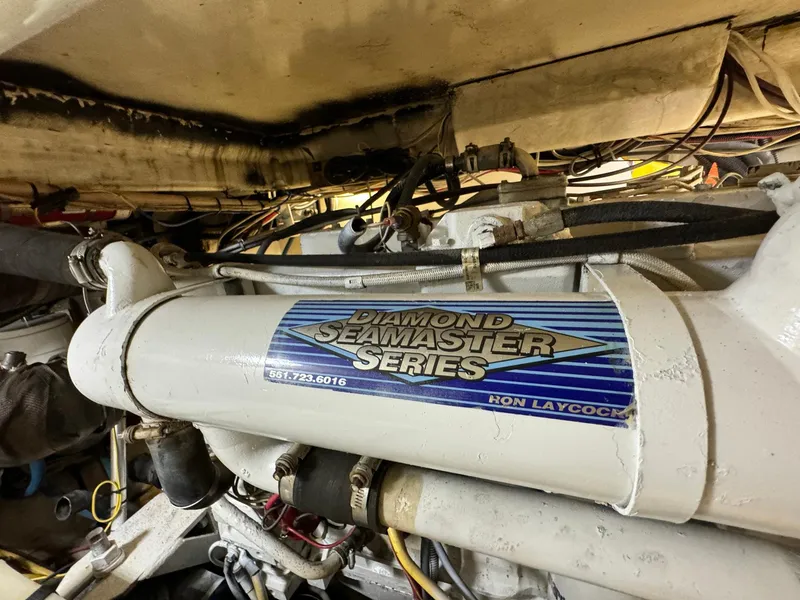Slide: The Image of Engine compartment of 2005 Custom Stardust 32 Express with Diamond Seamaster Series component. - 42