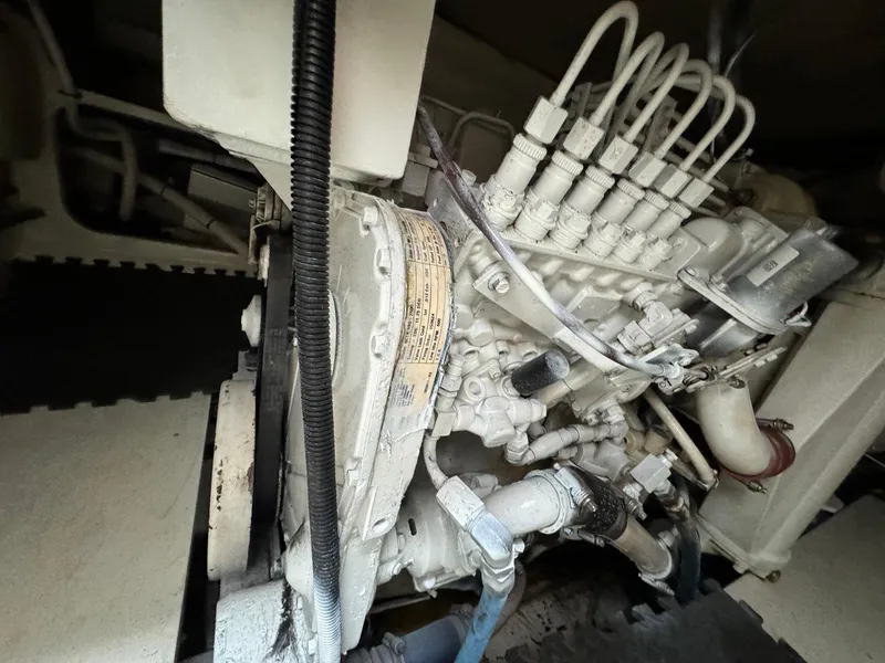 Slide: The Image of Engine of 2005 Custom Stardust 32 Express boat, showcasing intricate mechanical components. - 43