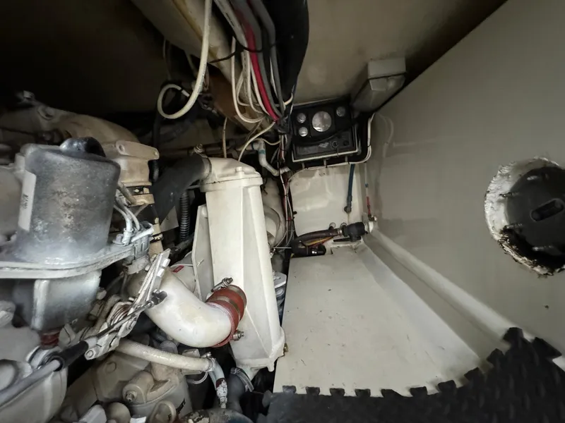 Slide: The Image of Engine compartment of 2005 Custom Stardust 32 Express with visible wiring and components. - 44