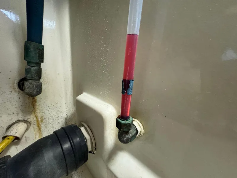 Slide: The Image of Close-up of plumbing components in a 2005 Custom Stardust 32 Express boat. - 49