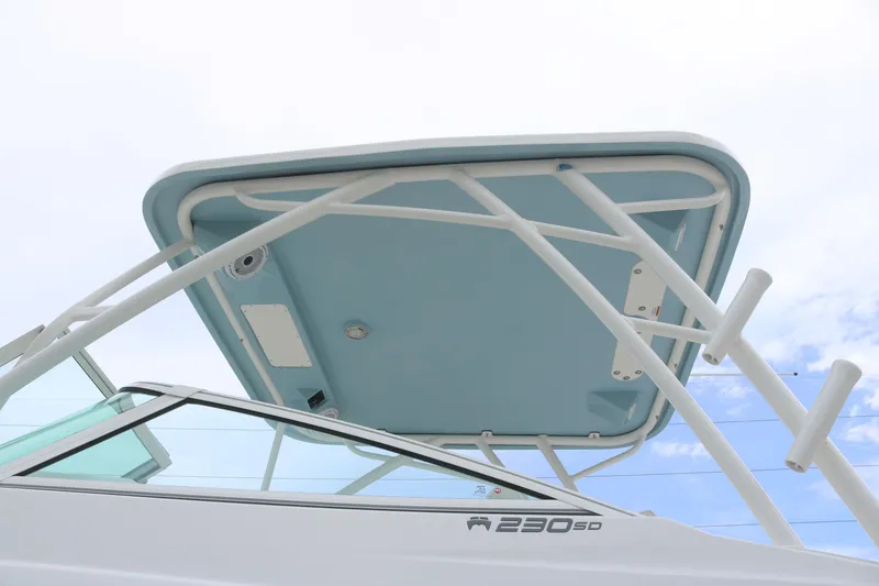 Slide: The Image of 2025 World Cat 230 SD boat with sleek design and sturdy T-top. - 5