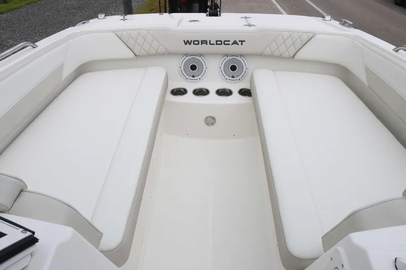 Slide: The Image of 2025 World Cat 230 SD boat interior with white seating and speakers. - 8