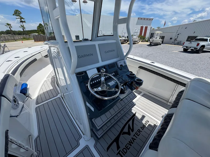 Slide: The Image of 2023 Tidewater 282 CC Adventure Bluewater boat cockpit with Garmin navigation system. - 28