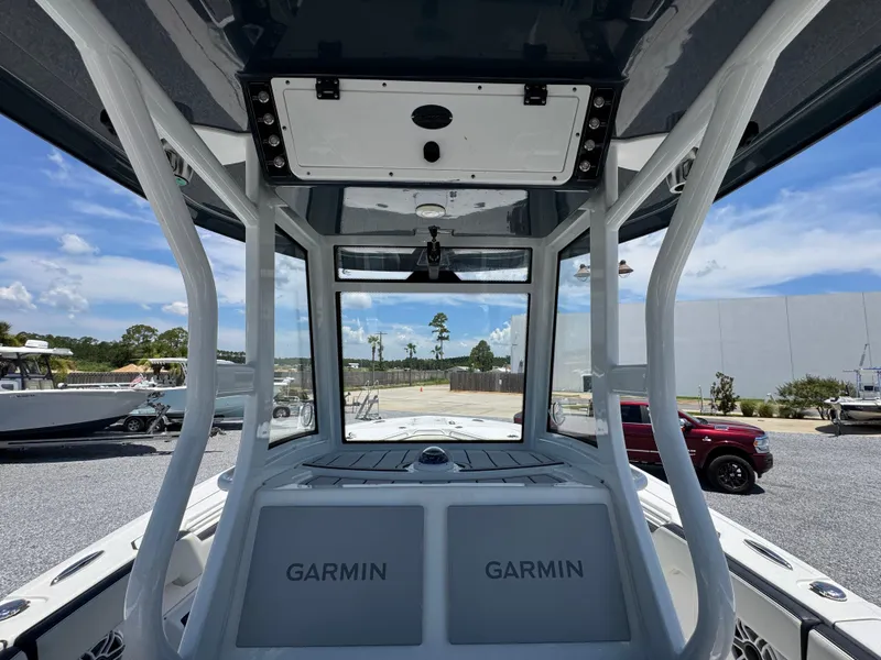 Slide: The Image of 2023 Tidewater 282 CC Adventure Bluewater boat interior with Garmin electronics. - 30