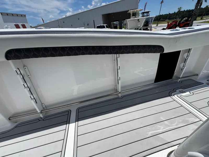 Slide: The Image of 2023 Tidewater 282 CC Adventure Bluewater boat interior with sleek deck design. - 32