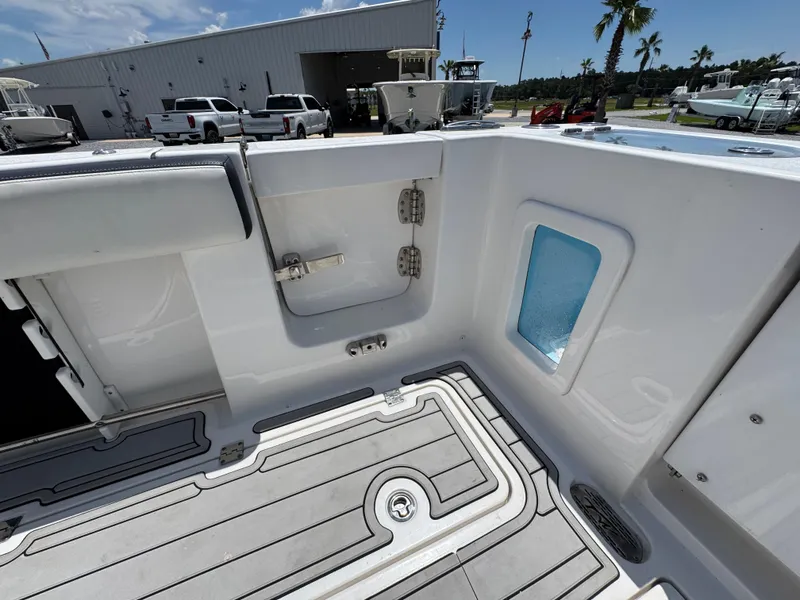 Slide: The Image of 2023 Tidewater 282 CC Adventure Bluewater boat interior with sleek deck design. - 36