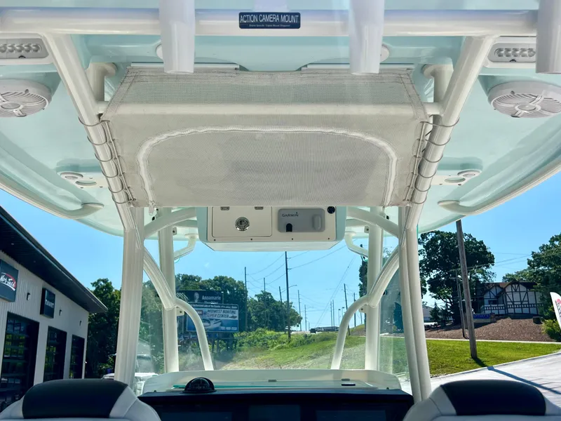 Slide: The Image of 2023 Sailfish 290 CC boat interior with action camera mount and Garmin equipment. - 10