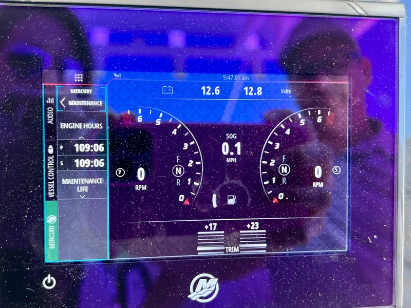 Slide: The Image of 2023 Sailfish 290 CC dashboard display showing engine metrics and maintenance details. - 20