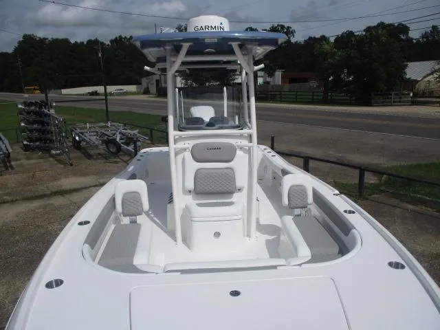 Slide: The Image of 2025 Caymas 26HB boat with Garmin equipment, docked outdoors on a sunny day. - 11