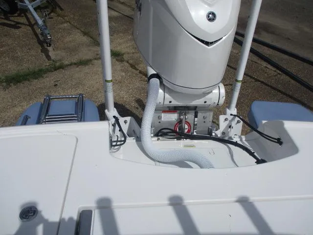 Slide: The Image of 2025 Caymas 26HB boat engine and deck view with ladder and cables. - 2