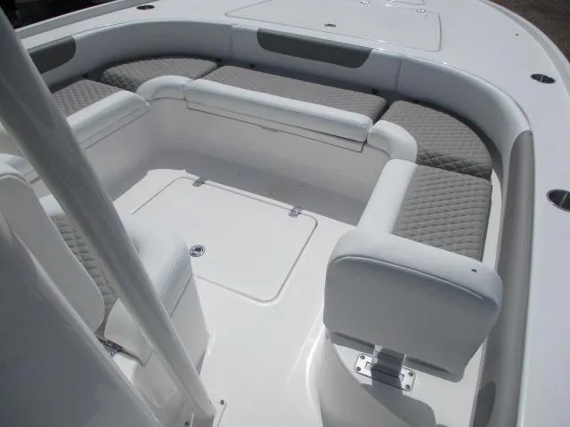Slide: The Image of 2025 Caymas 26HB boat interior with cushioned seating and storage compartments. - 3
