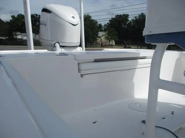 Slide: The Image of 2025 Caymas 26HB boat interior with seating and outboard motor. - 6
