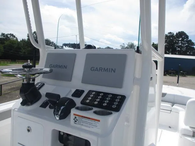 Slide: The Image of 2025 Caymas 26HB boat console with dual Garmin displays and control panel. - 8