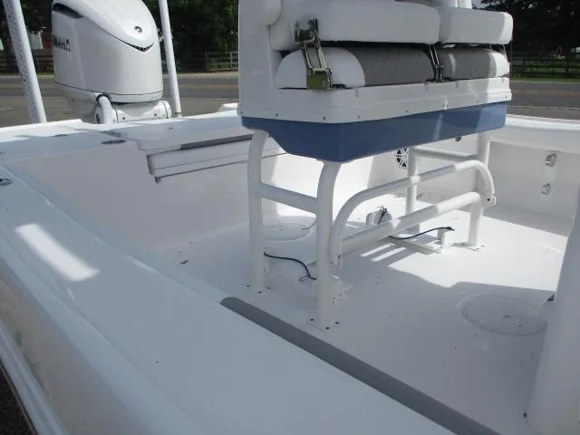 Slide: The Image of 2025 Caymas 26HB boat interior with seating and motor, showcasing spacious design. - 9