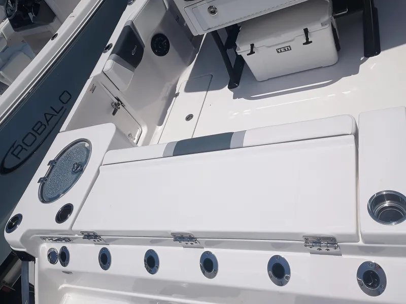 Slide: The Image of 2024 Robalo R250 Center Console boat interior with seating and storage features. - 10