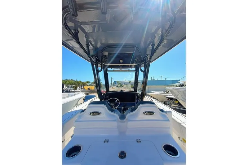 Slide: The Image of 2024 Robalo R250 Center Console boat interior with steering wheel and console view. - 17