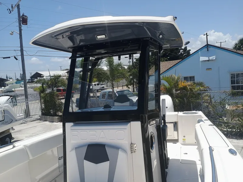 Slide: The Image of 2024 Robalo R250 Center Console boat with sleek design and spacious deck. - 22