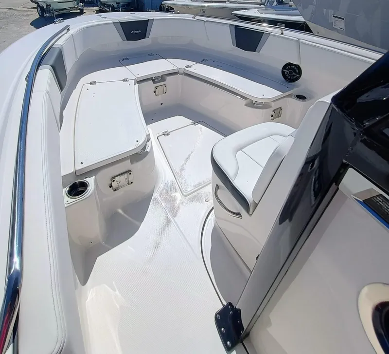 Slide: The Image of 2024 Robalo R250 Center Console boat interior with seating and storage compartments. - 23