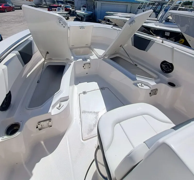 Slide: The Image of 2024 Robalo R250 Center Console boat interior with open storage compartments. - 26
