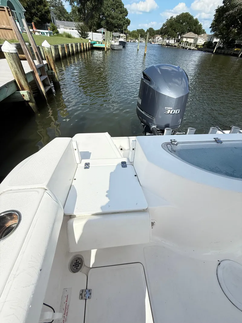 Slide: The Image of 2015 Sea Fox 256 Commander boat with Yamaha 300 engine on a calm waterway. - 17
