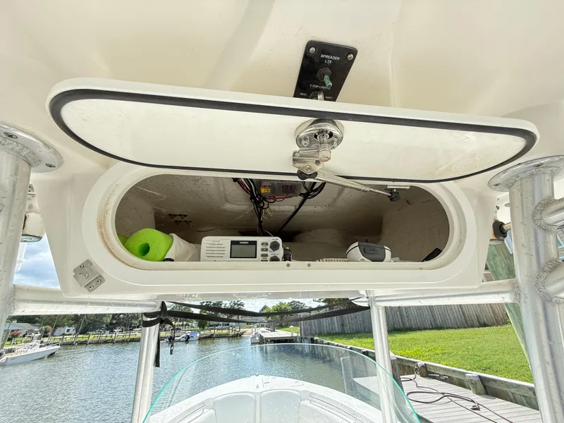 Slide: The Image of 2015 Sea Fox 256 Commander storage compartment with radio and equipment. - 19