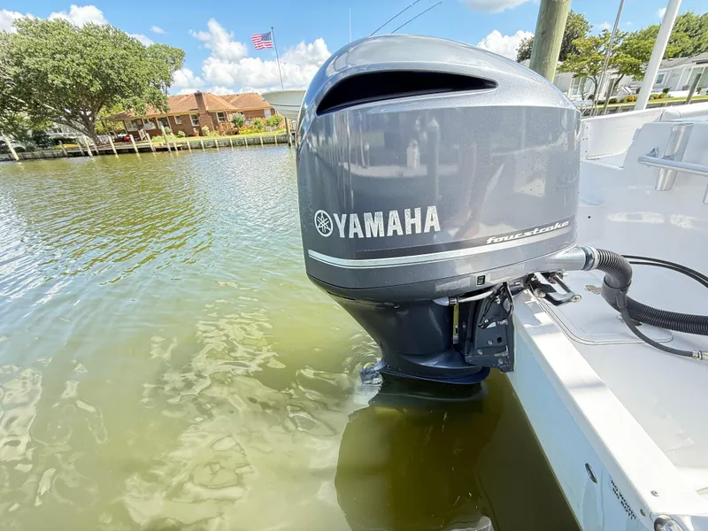 Slide: The Image of Yamaha outboard motor on 2015 Sea Fox 256 Commander in calm waters. - 23