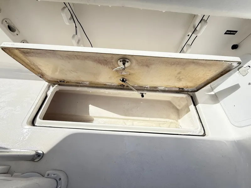 Slide: The Image of Open storage compartment on a 2015 Sea Fox 256 Commander boat. - 25