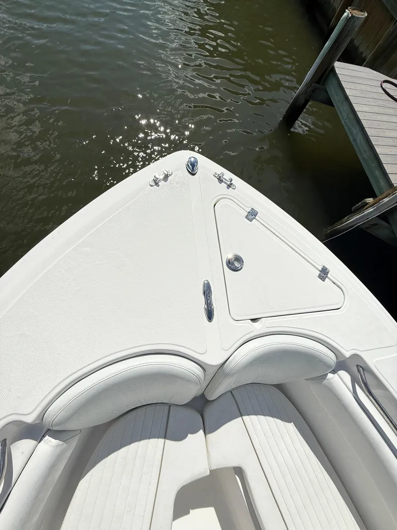 Slide: The Image of Bow of 2015 Sea Fox 256 Commander boat docked by water. - 27