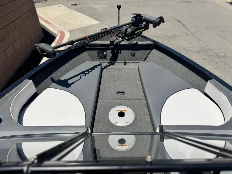 Slide: The Image of 2013 Smoker Craft Ultima 172 boat interior with trolling motor and seating. - 10