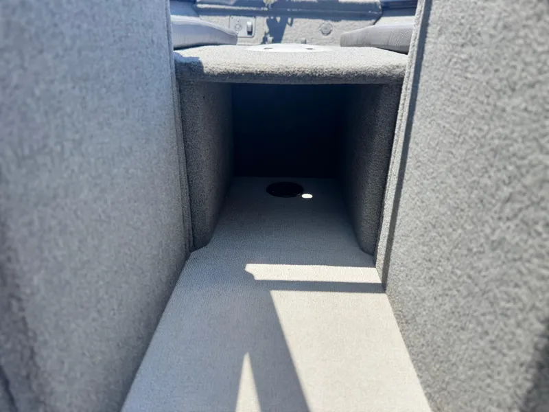 Slide: The Image of Interior storage compartment of 2013 Smoker Craft Ultima 172 boat. - 11