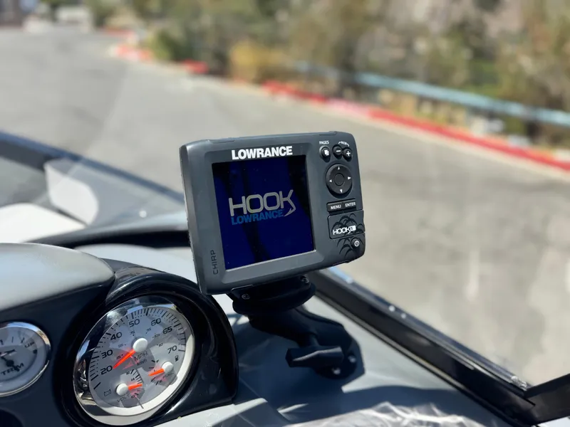Slide: The Image of Lowrance Hook fish finder on 2013 Smoker Craft Ultima 172 dashboard. - 19